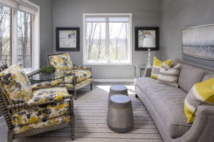 grey couch with yellow accents