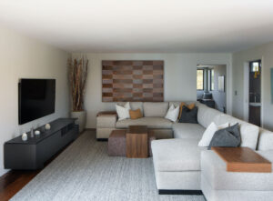 room with sectional sofa and wood accents