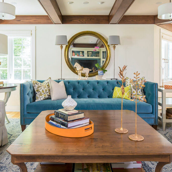 blue tufted couch in living room